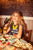 Sleeveless t-shirt w/ shoulder pads | Faded black  w/ "cheesy saucy crispy" print