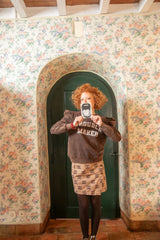 Short asymmetrical skirt  | Light brown w/ ethnic print