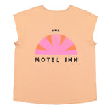 Sleeveless t-shirt w/ deep round neck . Old pink w/ "motel inn" print