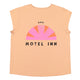 Sleeveless t-shirt w/ deep round neck . Old pink w/ "motel inn" print